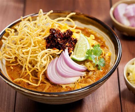 Khao Soi: A Creamy Coconut Curry Delight Infused With Tangy Lime and Crispy Noodles for an Unbeatable Thai Experience!