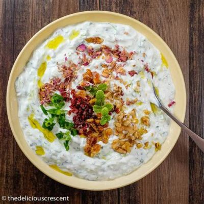  Mast-o Khiar: A Refreshingly Tangy Symphony of Yogurt and Herbs!